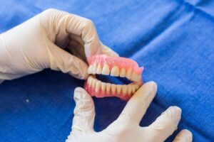 Can You Go From Wearing Dentures to Getting Implants