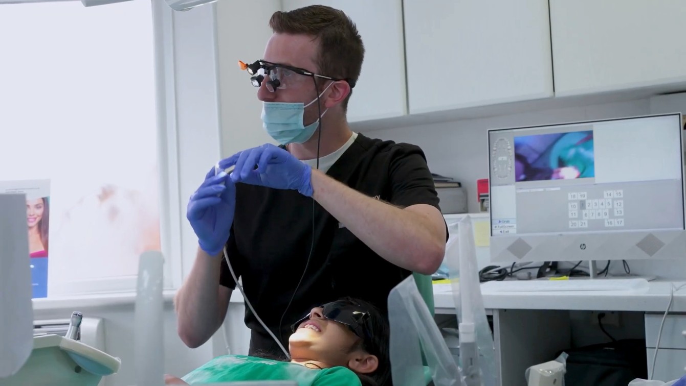 Dr Luke Levy treating patient