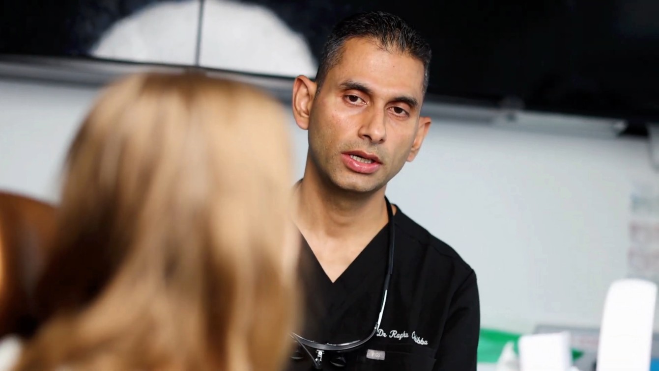 Dr Raghu Chhibba consulting patient