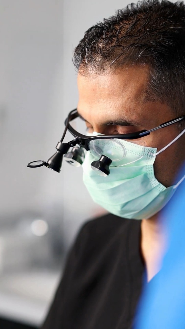 Dr Raghu Chhibba treating patient